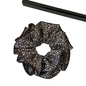 Pastoral style floral hair scrunchie in coffee brown with blue flowers on white background