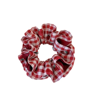 Red and white gingham scrunchie with cute strawberry print and soft fabric texture
