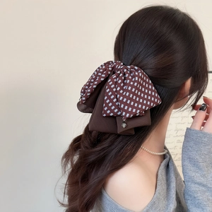Elegant Korean style plaid bow hair claw clip with water drop pendant on model