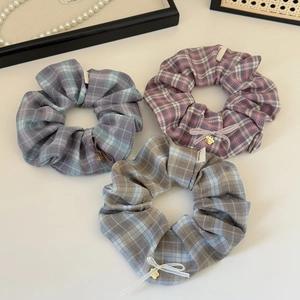 Three-piece vintage plaid scrunchies with heart pendants and elegant bow tie details