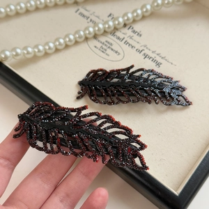 Elegant rhinestone leaf hair clips with delicate mesh and vintage gothic feather design