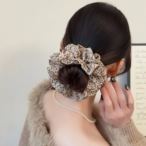 Floral print oversized scrunchie in beige with delicate blossoms for elegant buns