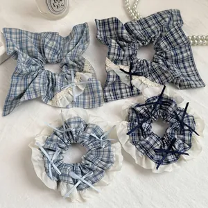 Blue plaid scrunchies set with lace edges and ribbon bows for elegant hair styling