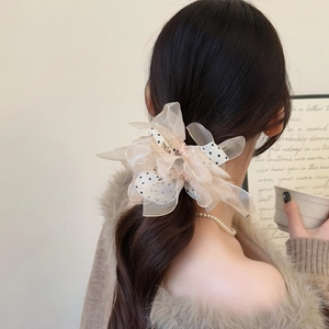 Polka dot mesh ribbon oversized scrunchie for voluminous ponytail styling in champagne