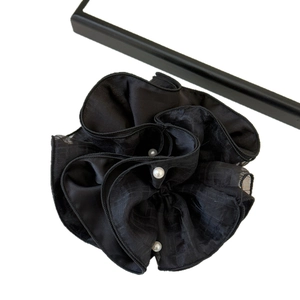 Elegant black mesh hair scrunchie with subtle grid texture and three faux pearl accents