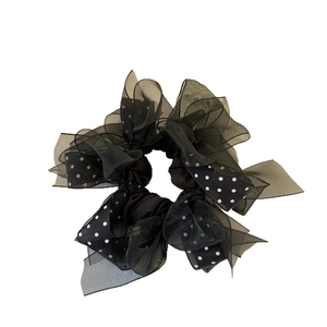 Chic black organza scrunchie with white polka dot ribbon for voluminous hairstyles