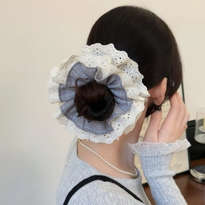 Elegant plaid hair scrunchie with four layers of lace on a messy bun hairstyle
