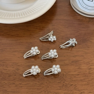 Elegant pearl flower hair clips set for women featuring minimalist silver metal design