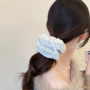 Blue plaid scrunchie with lace trim and pearl bow detail for women's hair styling