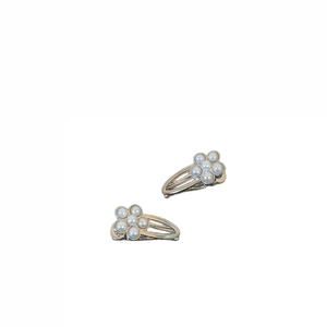 Elegant pair of pearl flower hair clips in minimalist Korean style on white background