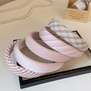 Set of five pink padded headbands with various patterns including plaid and silk fabrics