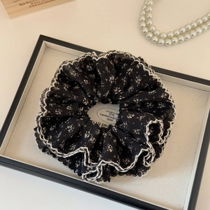 Elegant floral chiffon scrunchie in black and white with delicate lace trim edges