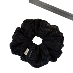 Elegant black pleated mesh scrunchie with a handmade label for daily hairstyle
