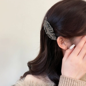 Elegant leaf hair comb with sparkling crystals on a model for a sophisticated hair look