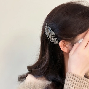 Elegant rhinestone leaf hair comb hair clip accessory for women styled in dark hair