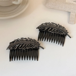 Set of two elegant leaf hair combs with charcoal rhinestones for stylish hair styling