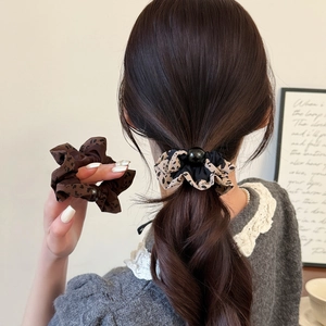 Elastic leopard print scrunchies with black beads for stylish women ponytails