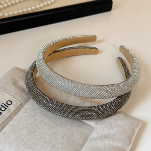 Detail of sparkling rhinestone headbands in silver and grey with velvet inner lining