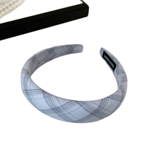 Light blue plaid headband with handmade label shown on a clean white background