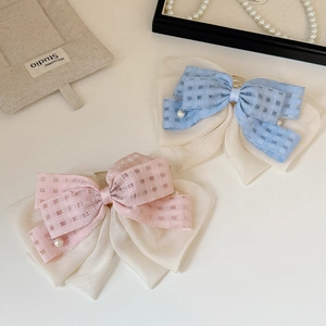 Elegant pink and blue plaid bow hair clips with white pearl beads for a sweet style