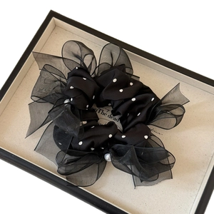 Elegant black polka dot mesh scrunchie with organza fabric and decorative white pearls