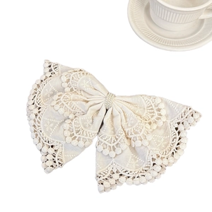 Elegant Bohemian lace bow hair clip with pearls and intricate embroidery details