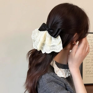 Elegant white floral lace bow hair clip with black silk ribbon for stylish women