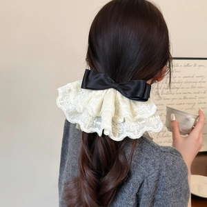 Elegant large black satin bow hair clip with layered cream lace floral embroidery