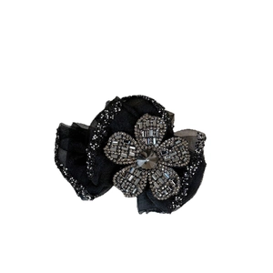 Elegant black rhinestone flower claw clip hair accessory with sparkling silver crystals