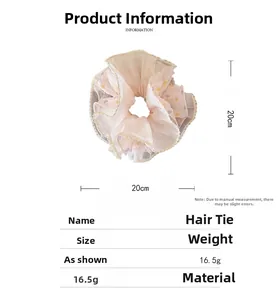 Details von Mesh-Schichten mit Punkten und Spitzenbesatz an einem 20 cm Haargummi