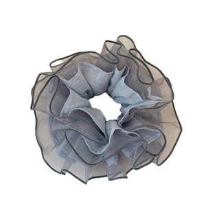Oversized organza scrunchie in dual-layer blue and grey sheer fabric with pleated texture