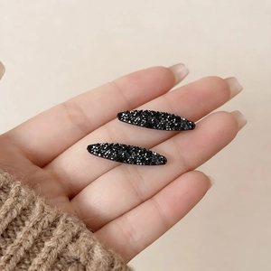 Sparkling black rhinestone oval hair clips set of two for elegant fringe styling