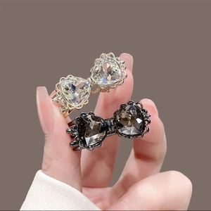 Paire de barrettes à cheveux nceud avec cristaux en cceur étincelants en or et bronze