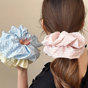 Colorful striped scrunchies in pink, blue, and yellow with sweet bow patterns