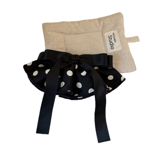 Satin polka dot bow hair clip with elegant streaming ribbons and a cream linen gift pouch