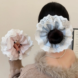 Sweet plaid scrunchies with white lace edges in blue and pink for stylish hair styling