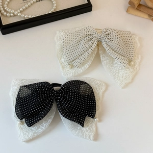 Polka dot mesh lace bow hair clip with pearl accents and elegant vintage style