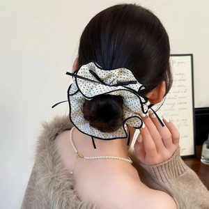 Classic white mesh scrunchie with black polka dots and ribbons for elegant hairstyles