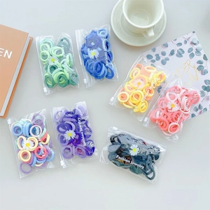 Colorful high elasticity hair bands set in transparent bags with daisy floral accents