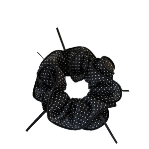 Elegant black mesh hair scrunchie with white polka dots and delicate bow detail