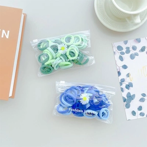 Vibrant blue and light green high-elasticity towel ring hair ties in a PVC zipper bag