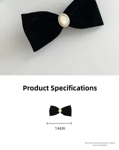 Detail view of a 14cm black velvet bow hair clip with pearl centerpiece and dimensions