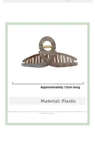 Detail of 13cm grey marble hair claw clip with interlocking teeth and gold metal spring