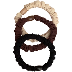 Three-piece elastic scrunchie set in beige, brown, and black with resin oval charms