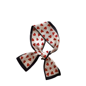 Elegant white skinny silk scarf with red heart patterns and black border trim