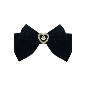 Elegant black velvet bow hair claw with camellia heart detail and sparkling rhinestones