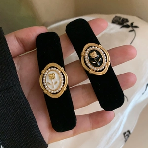 Pair of retro black velvet hair clips with gold rose and pearl frame decoration
