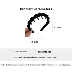 Detail view of black velvet braided headband with teeth showing 14cm x 15.5cm dimensions