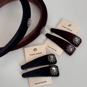 Detail of velvet headbands and hair clips with sparkling crystal ornaments