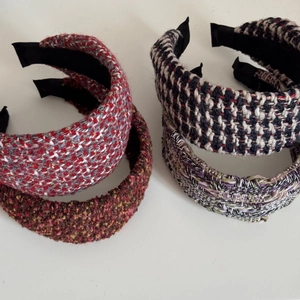 Detailed view of four assorted tweed padded headbands with vintage thick knit textures
